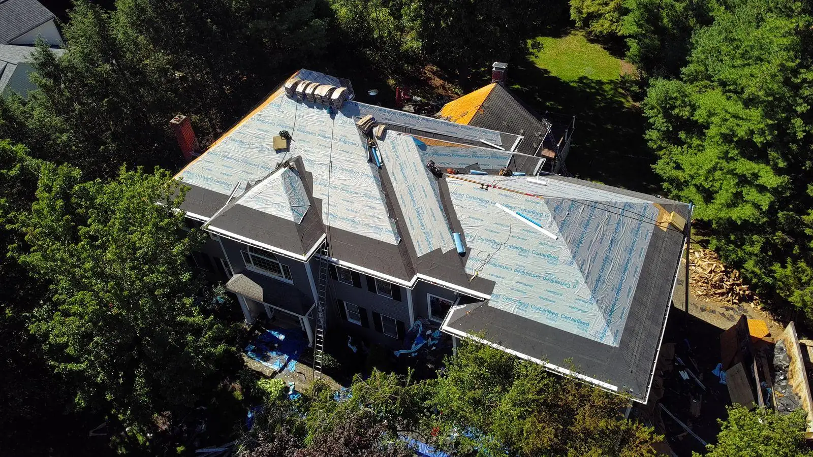 Roof replacement in progress — aerial view